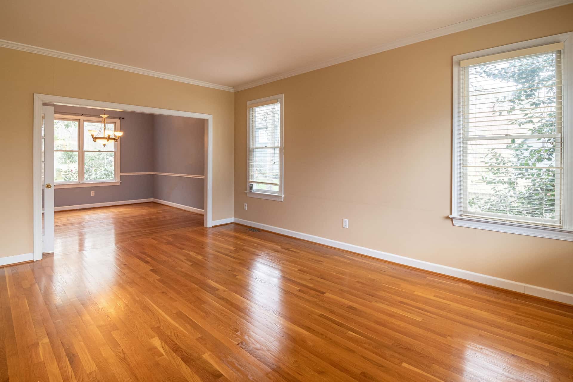 A bright empty room with wooden floors