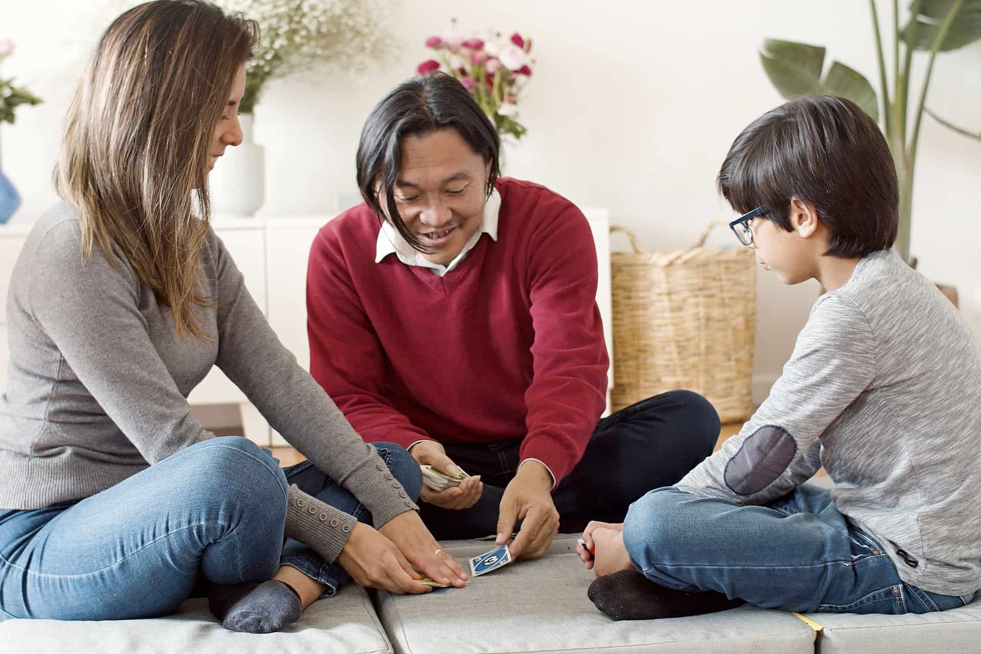 A family playing a game together in a living room
