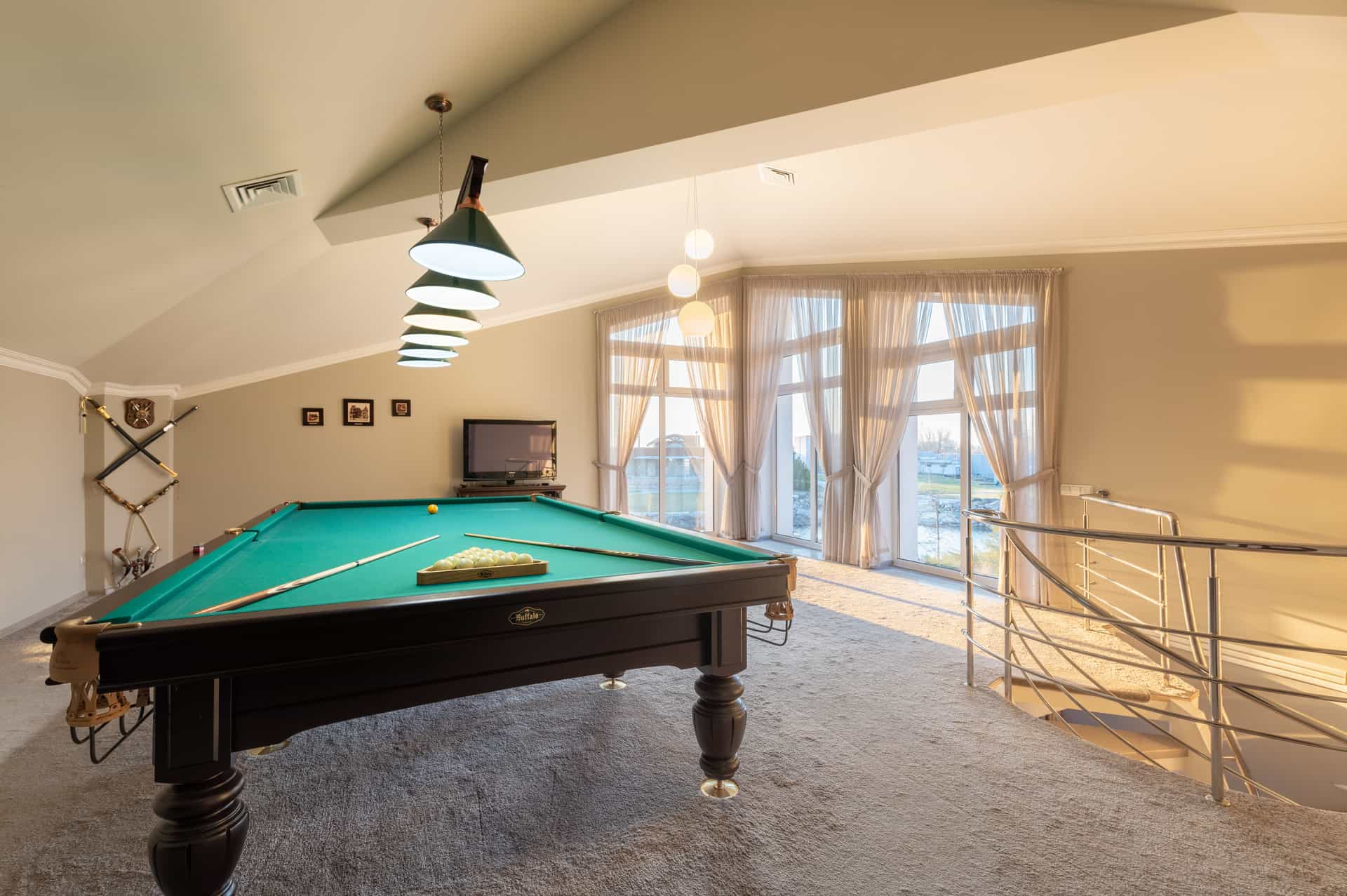 A home game room with a pool table and seating