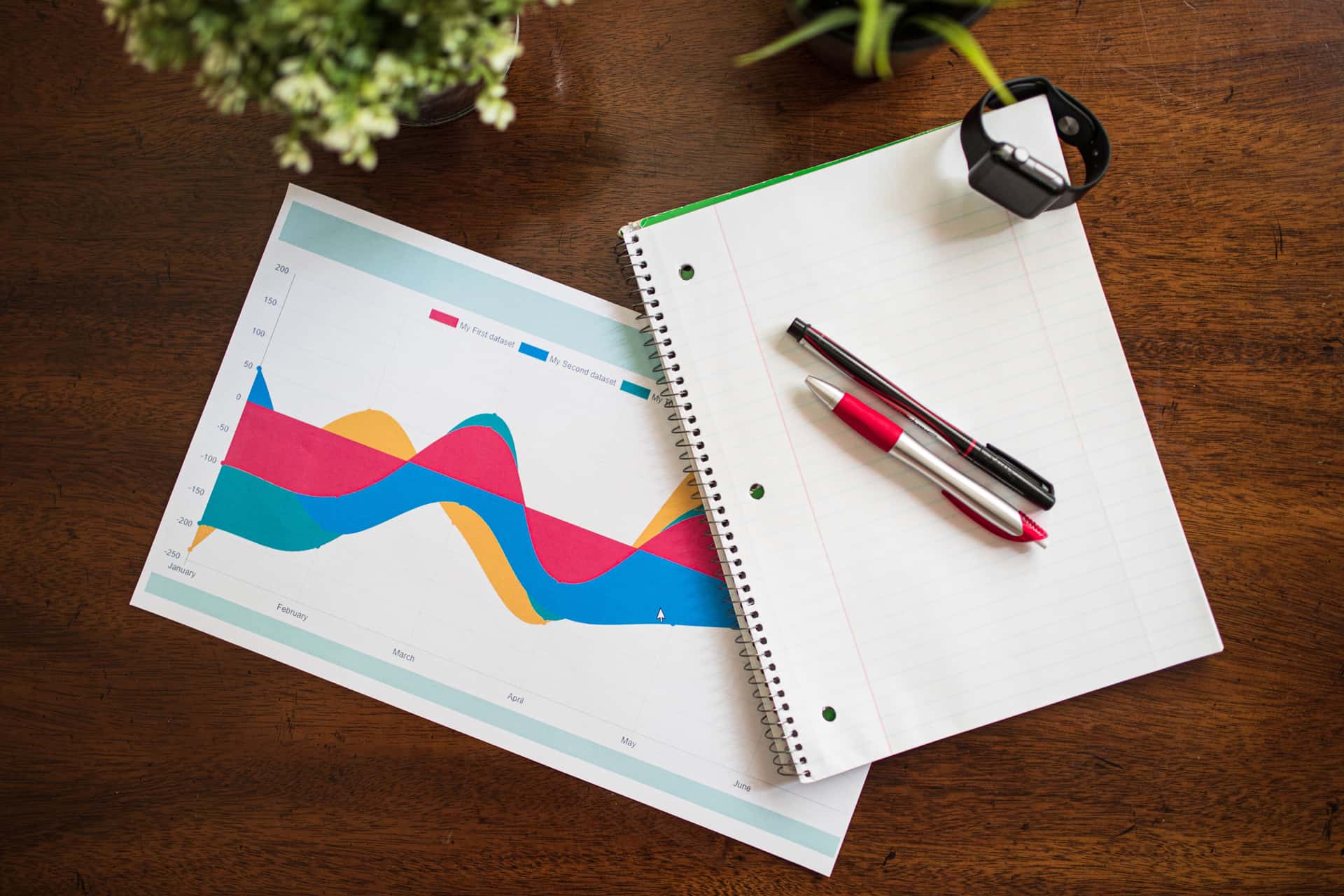 A notebook and pen on a desk