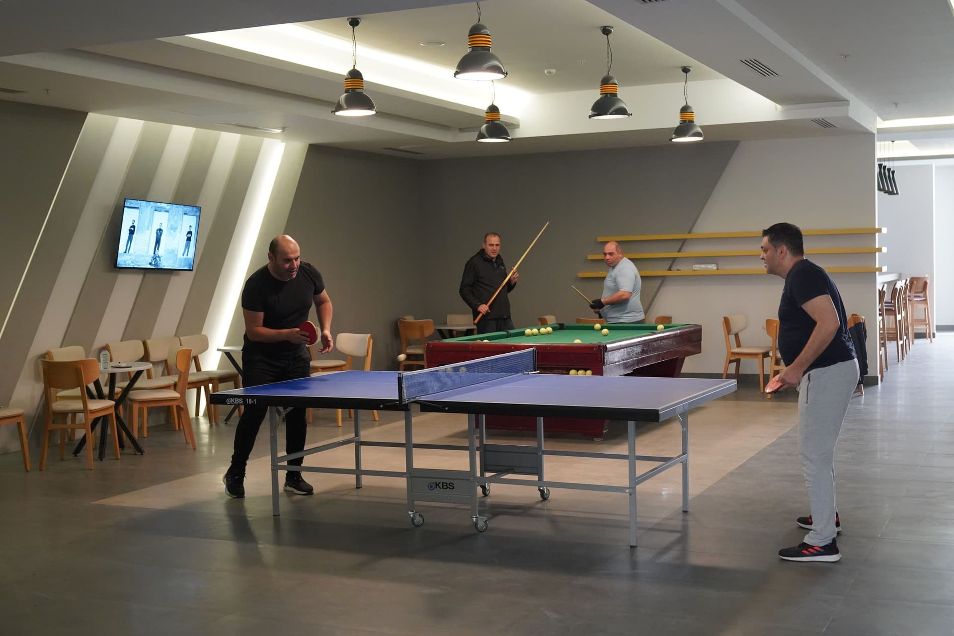 A games room with a combo table set up for play