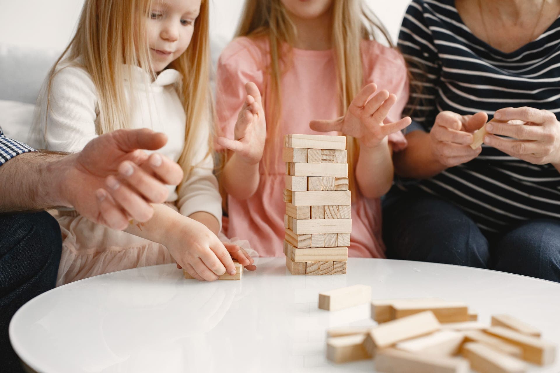 A family playing a table game together at home