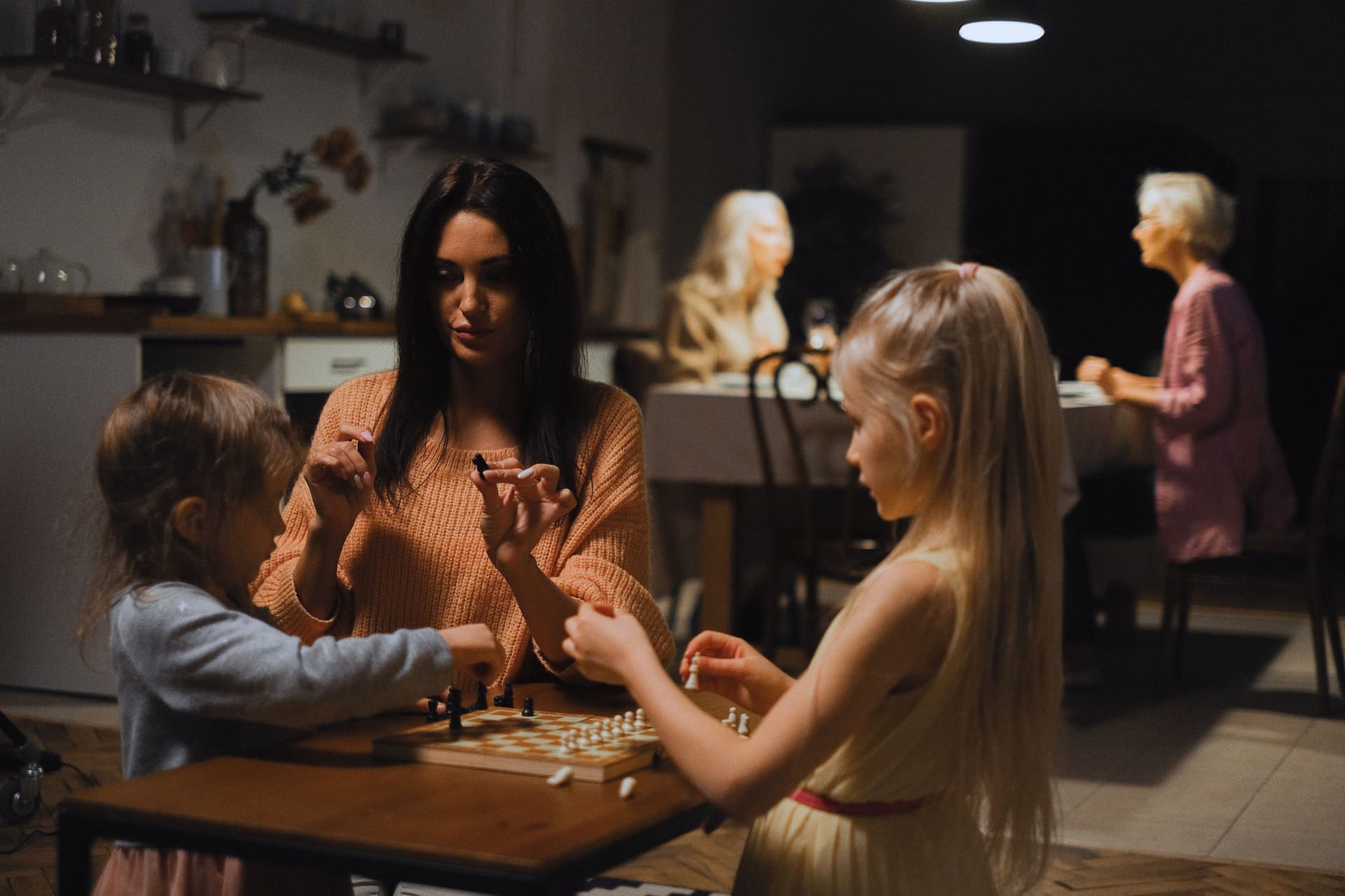 A family playing a table game together at home