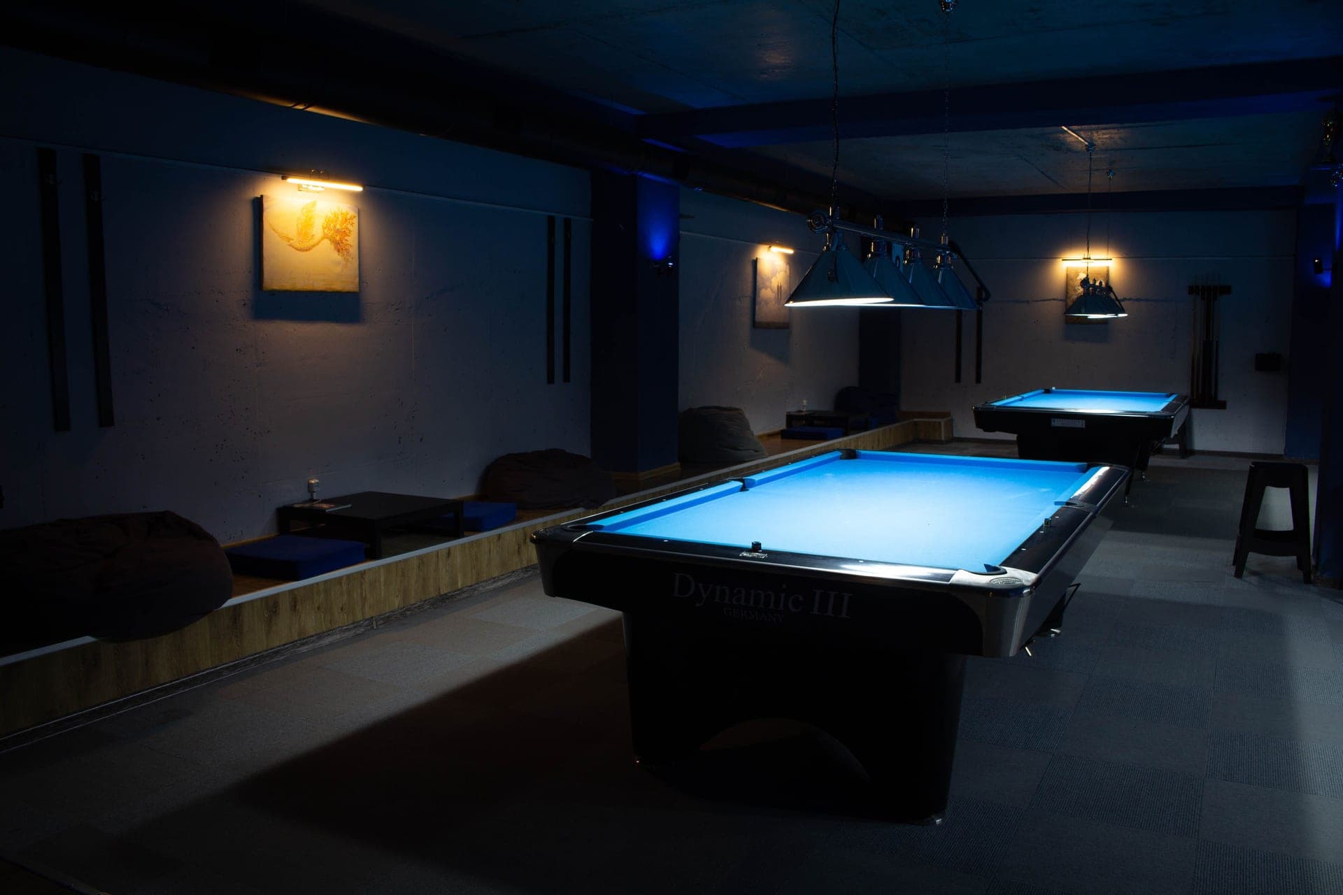 A table tennis conversion top sitting on a pool table