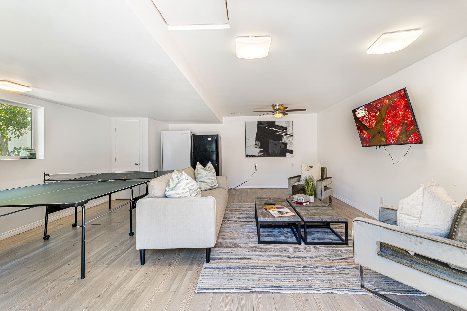 A ping pong table set up in a bright indoor room