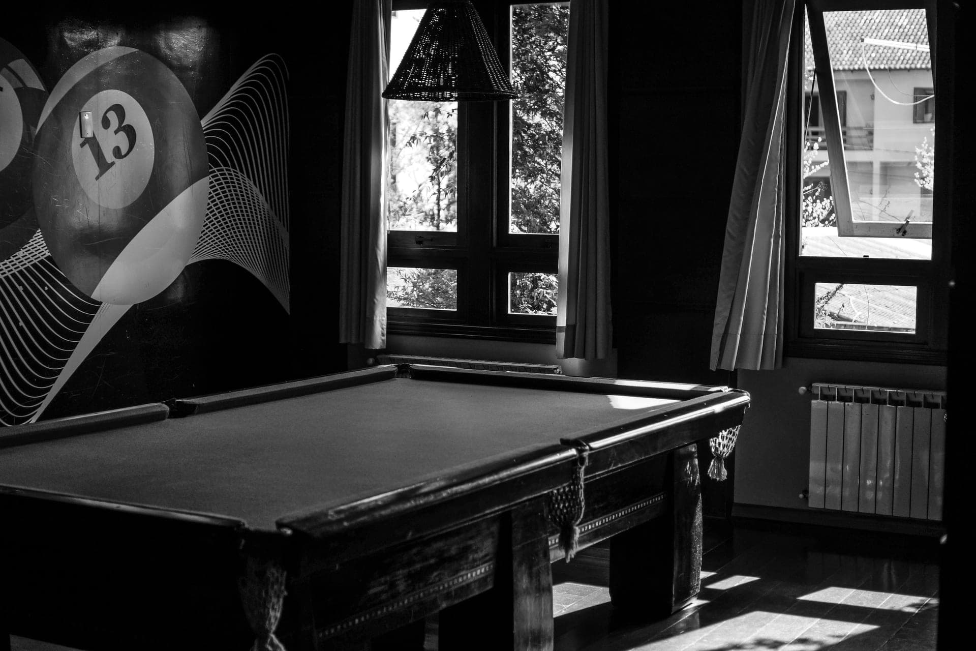 A pool table set up in a home game room