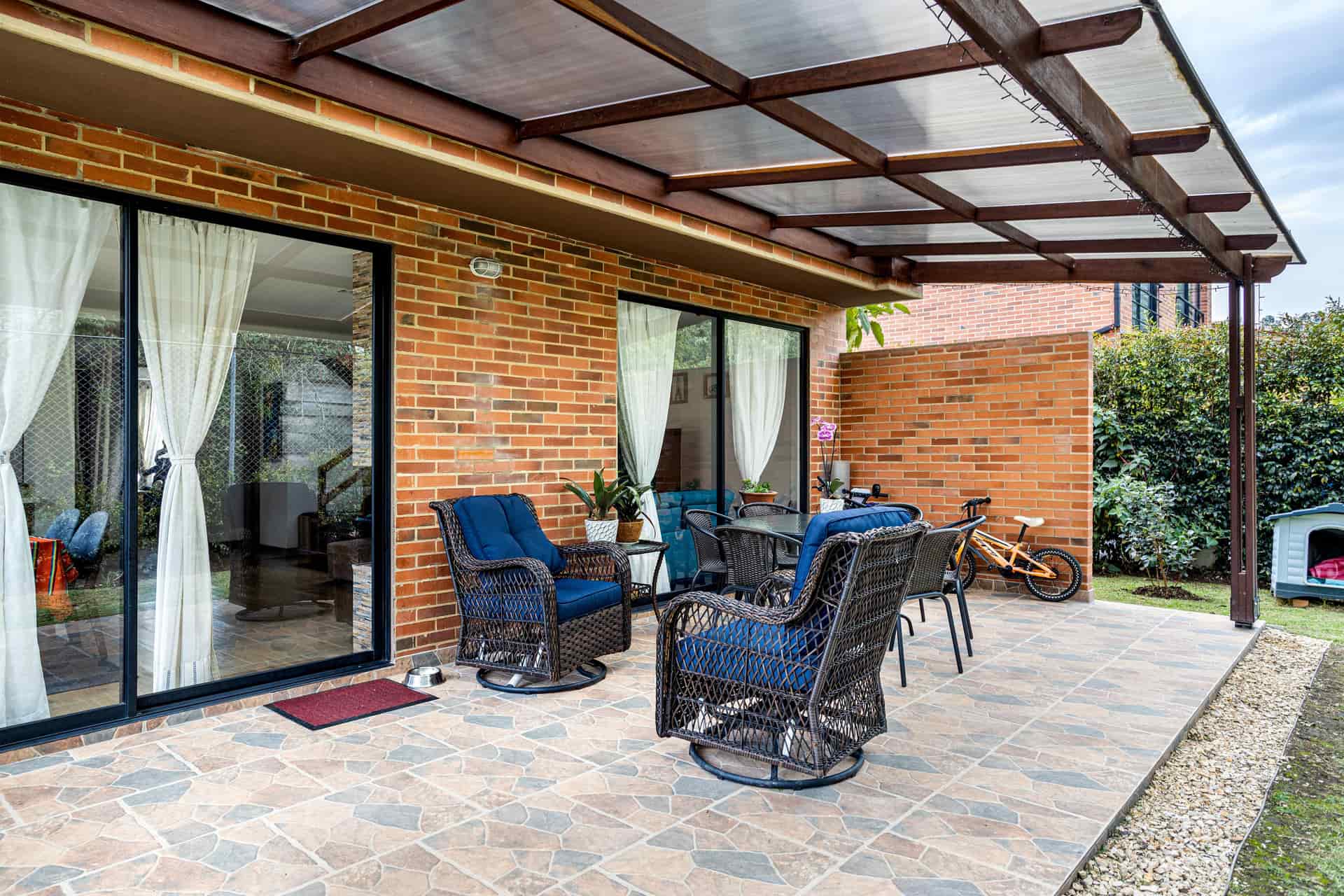 A covered outdoor patio set up for entertaining